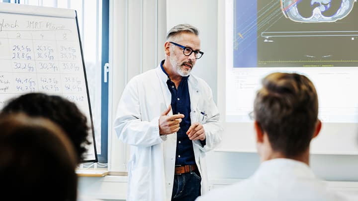 A scientist teaching a class